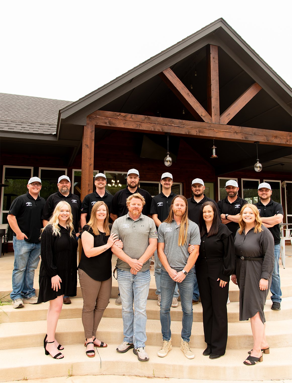 Rockstar Roofing Team standing in front of building